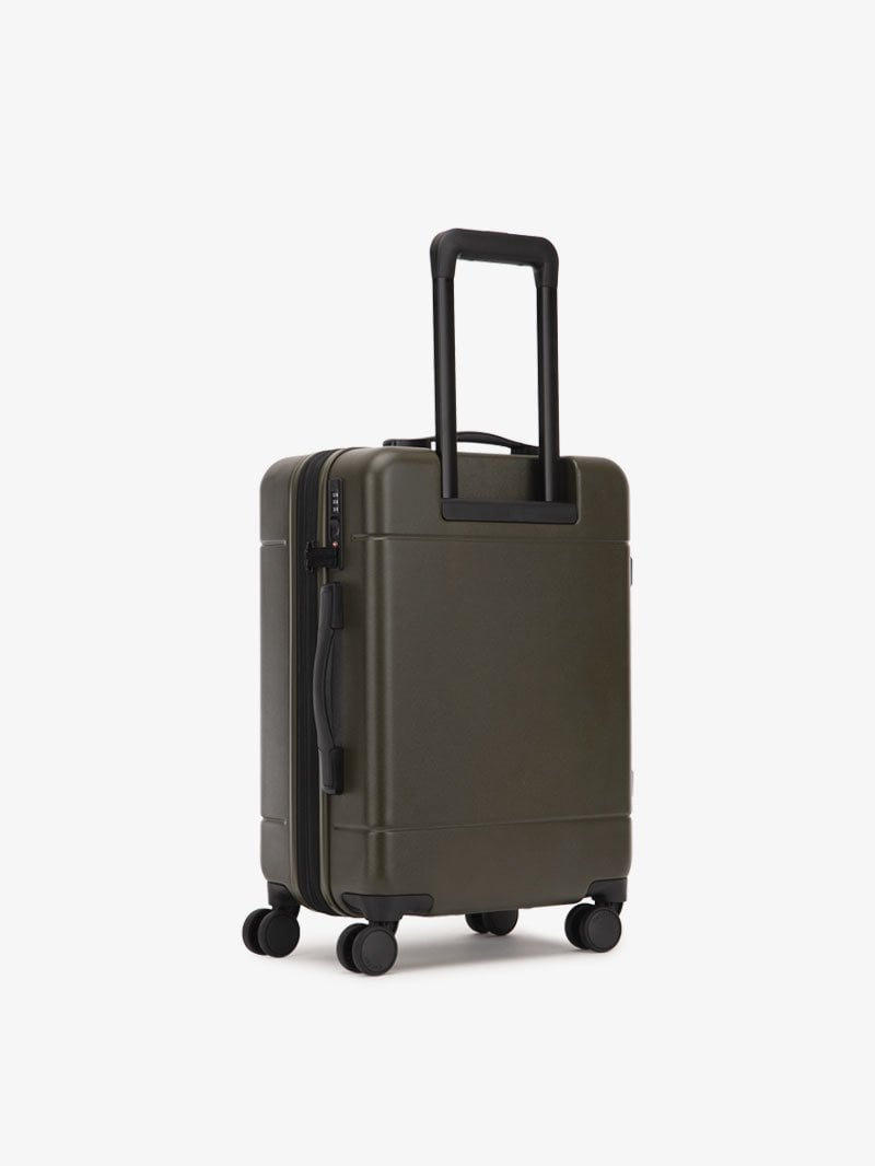 CALPAK Hue hard side carry-on luggage with spinner wheels in green moss color