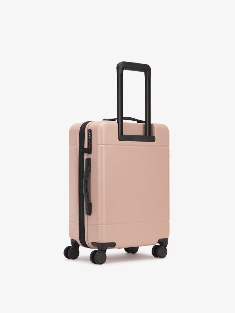 CALPAK Hue hardside carry-on luggage with spinner wheels in pink sand color