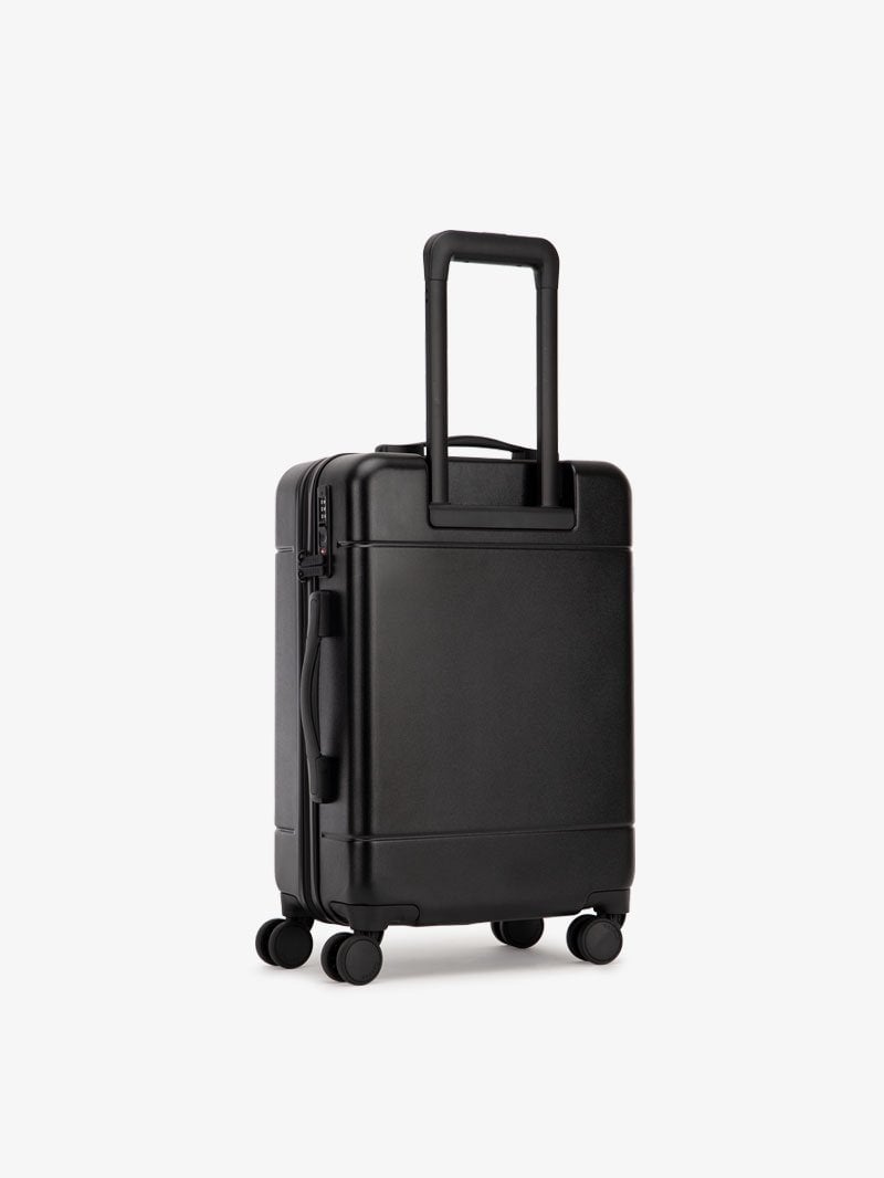 CALPAK Hue leightweight polycarbonate carry-on suitcase with laptop pocket in black color