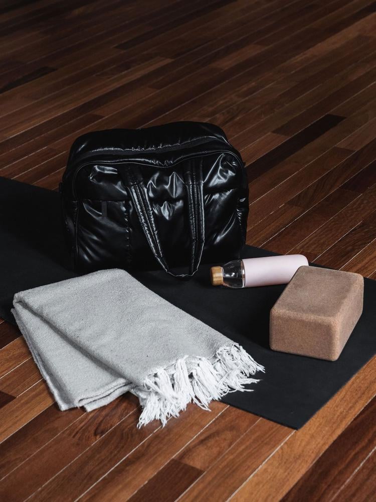 black CALPAK Luka duffel bag for gym