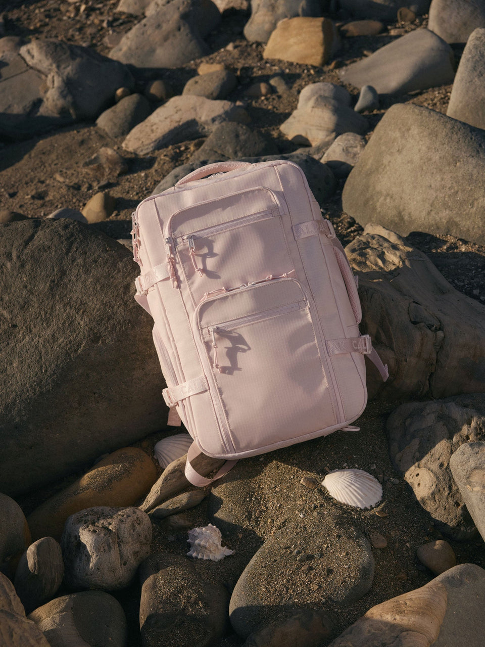 CALAK Terra 26L in Shell Pink on beach rocks