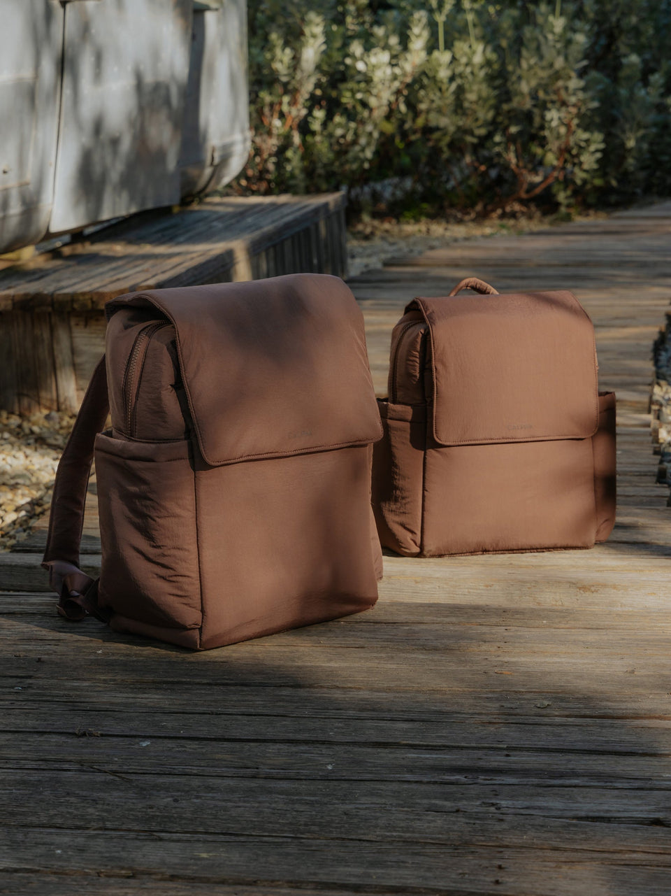 CALPAK Diaper Backpack and Convertible Mini Diaper Backpack in brown Hazelnut outside