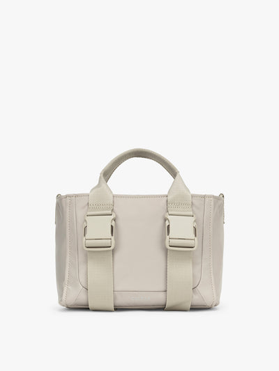 CALPAK Fit Gym Crossbody Bag in beige Greige front view with white background; ABF2601-GREIGE view 1