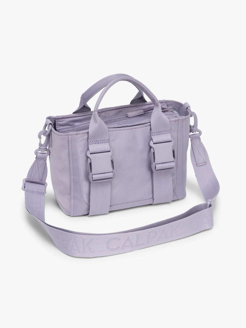 CALPAK Fit Gym Crossbody Bag in light purple Iris side view with white background