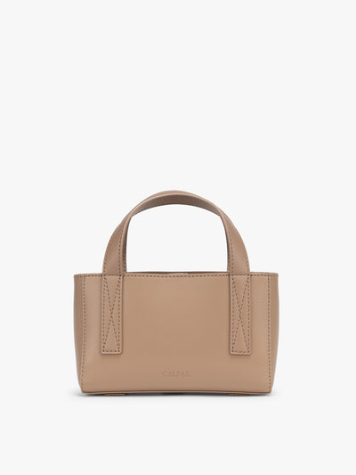 CALPAK Haven Mini Crossbody Bag in beige Taupe front view; AMC2501-TAUPE view 1