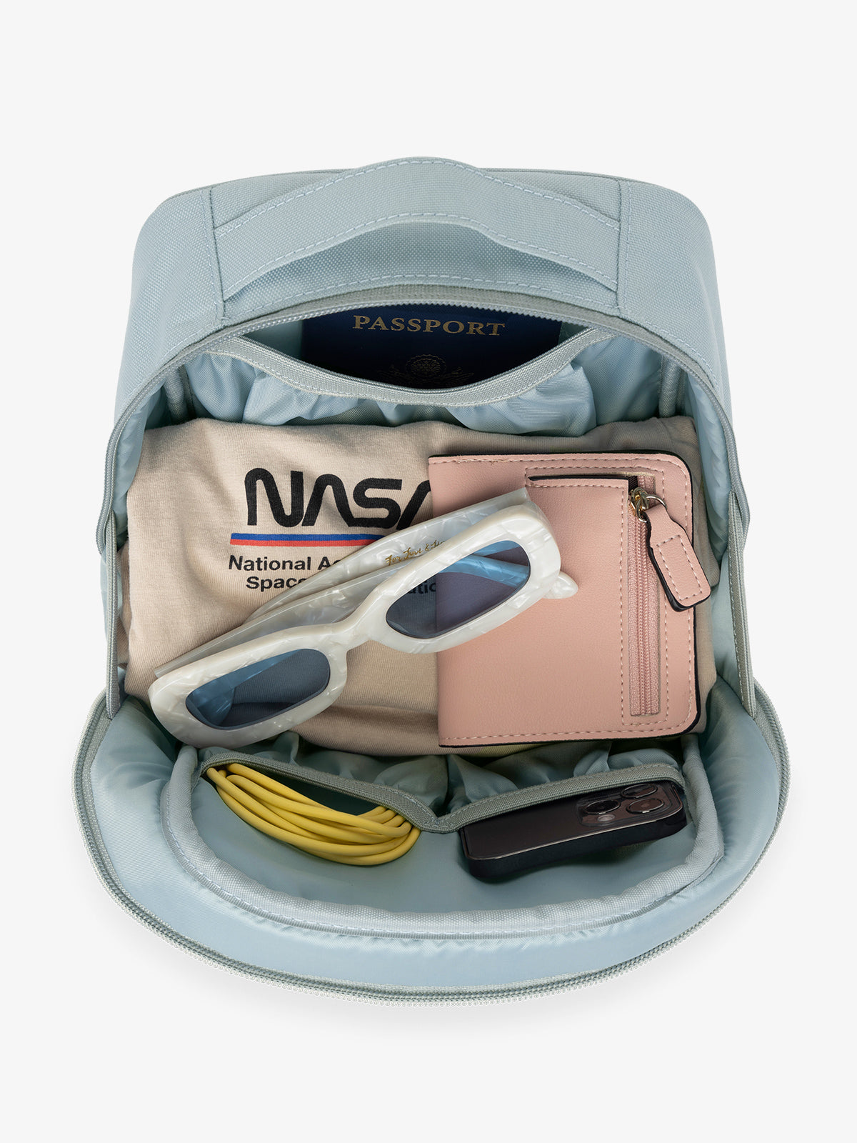 CALPAK Everything Cube in blue Bluebell with various items inside such as sunglasses, wallet, phone, and phone charger; ACE2401-BLUEBELL