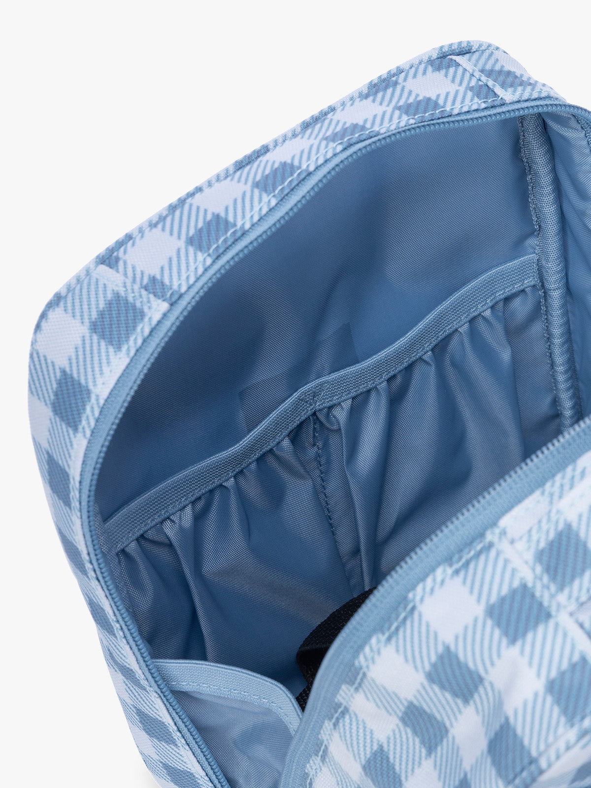 Compartment pockets in the CALPAK Everything Cube in light blue and white gingham print ; ACE2401-FRENCH-BLUE-GINGHAM