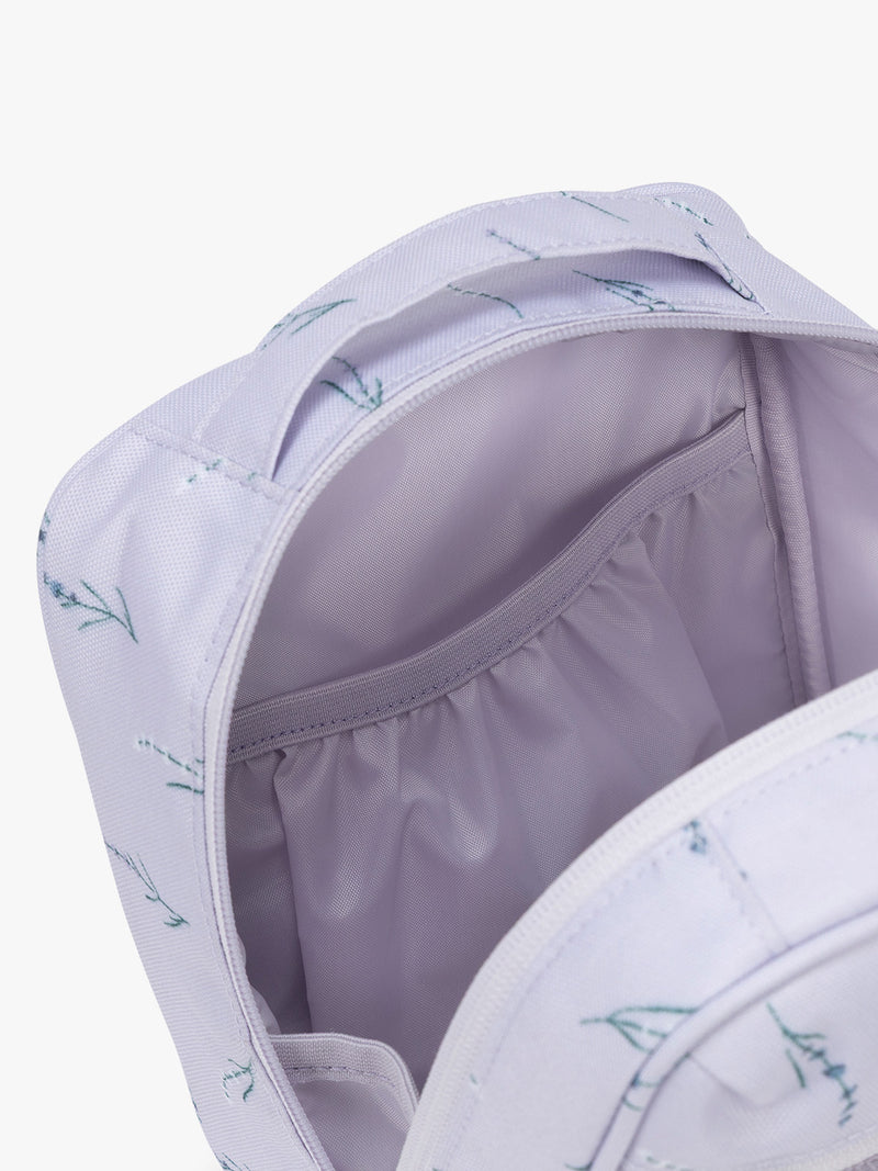 Pockets of CALPAK Everything Cube in light purple with lavender flower print