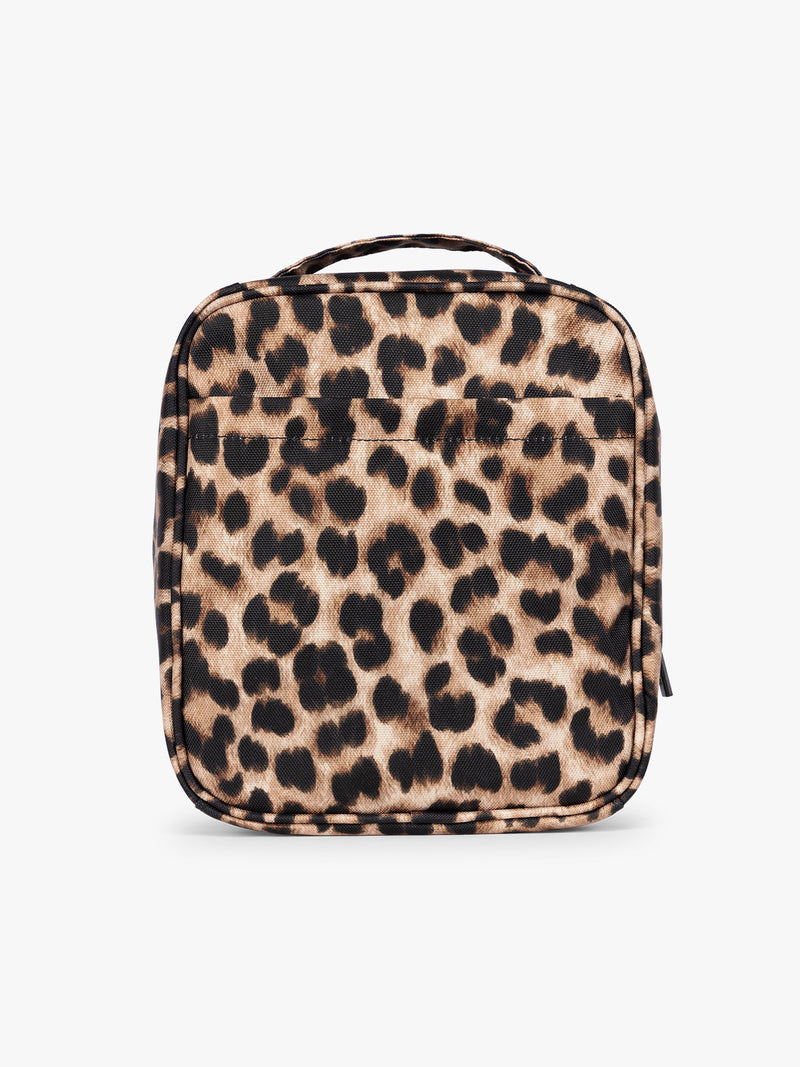 Backside of Leopard print in Leopard the CALPAK Everything Cube organizer with a top handle, a front zippered pocket, and a textured mesh lower panel, shown against a plain white background