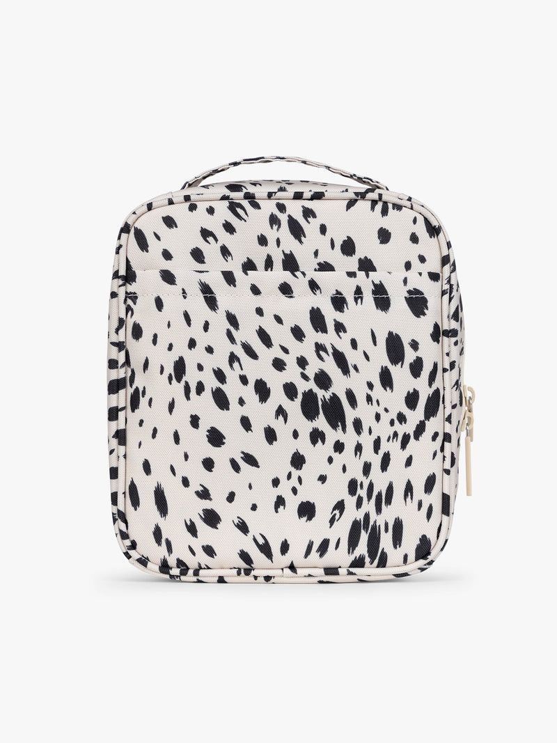 Backside of a white with black leopard print in Snow Leopard the CALPAK Everything Cube organizer with a top handle, a front zippered pocket, and a textured mesh lower panel, shown against a plain white background