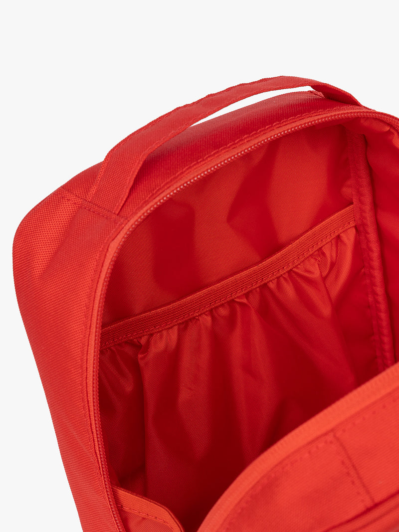 Pockets of CALPAK Everything Cube in red Tomato