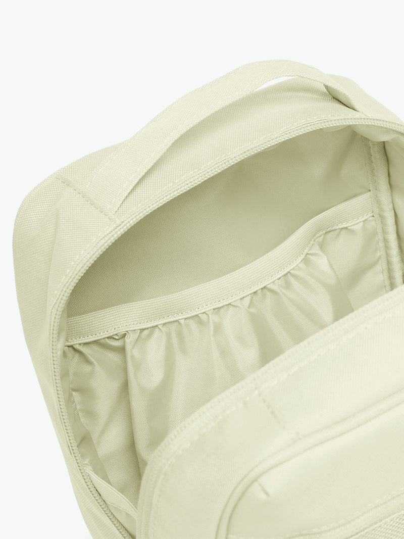 Pockets of CALPAK Everything Cube in light green Celadon