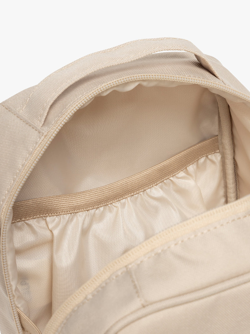 Inside pocket of CALPAK Everything Cube in beige Oatmeal