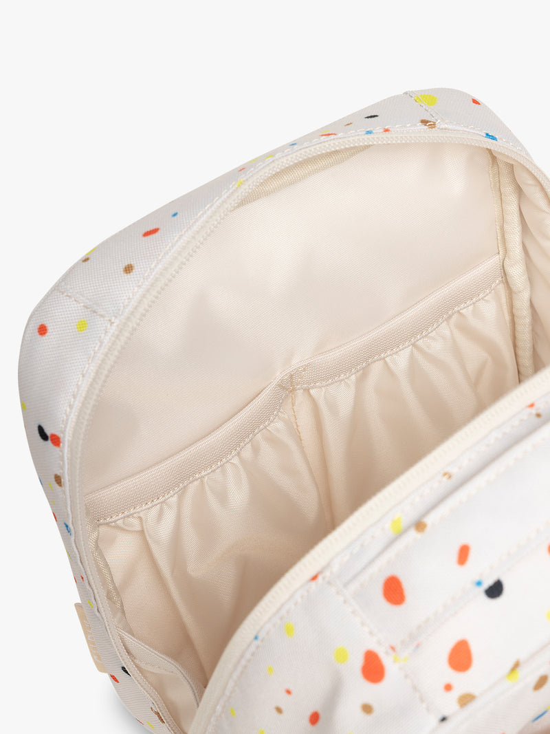 Inside of CALPAK Everything Cube in beige with speckle pattern