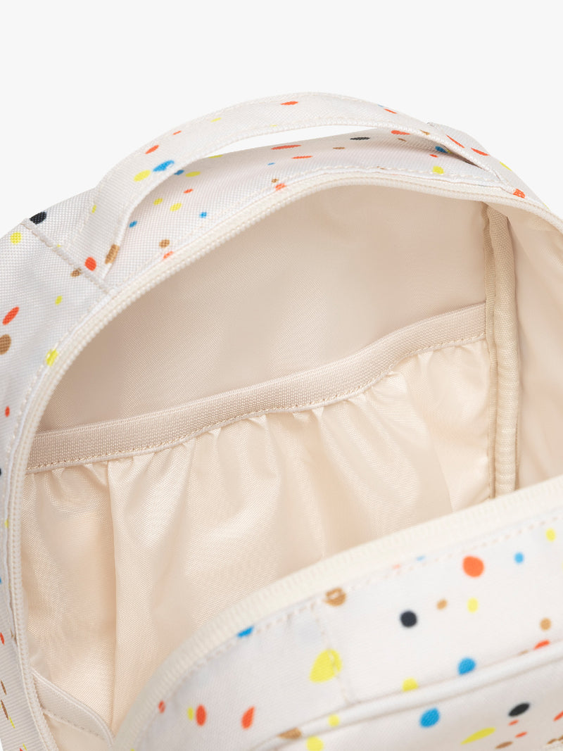 Inside of CALPAK Everything Cube in beige with speckle pattern