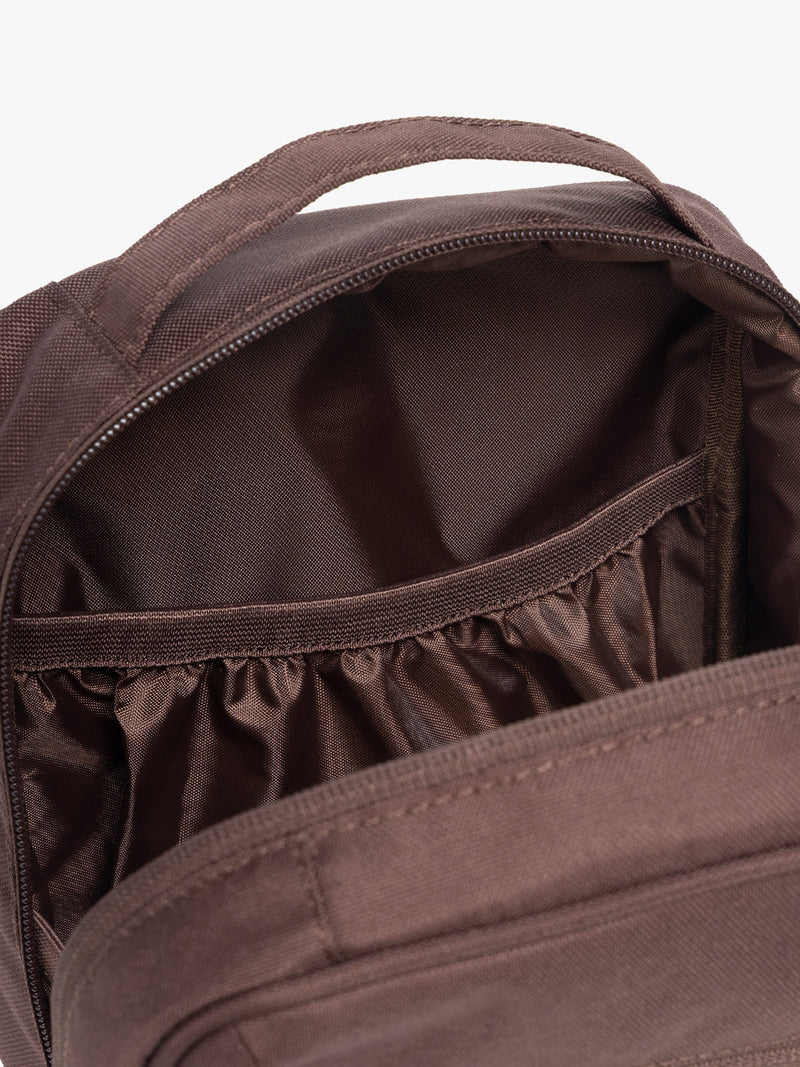 Interior pocket of CALPAK Everything Cube in brown Walnut
