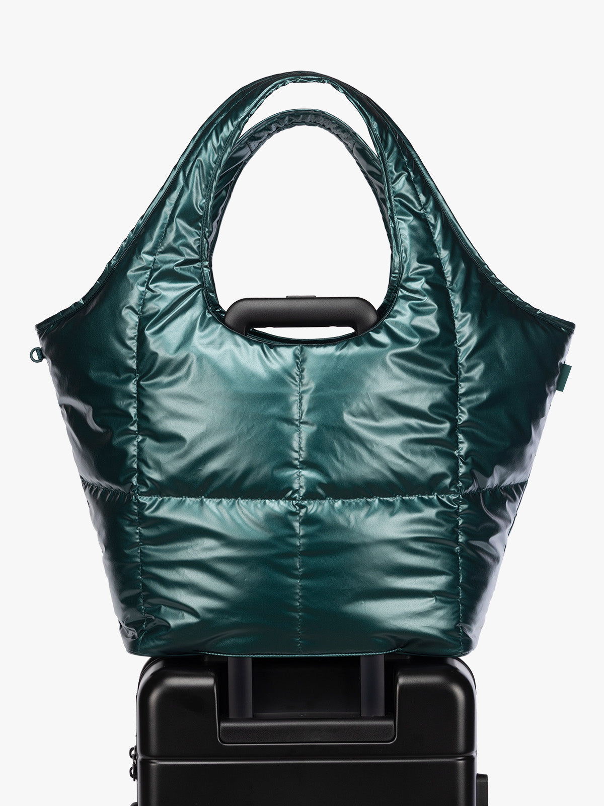 Luggage trolley sleeve of CALPAK Luka Everything Tote in dark green shiny Kale; AET2601-GLAZED-KALE