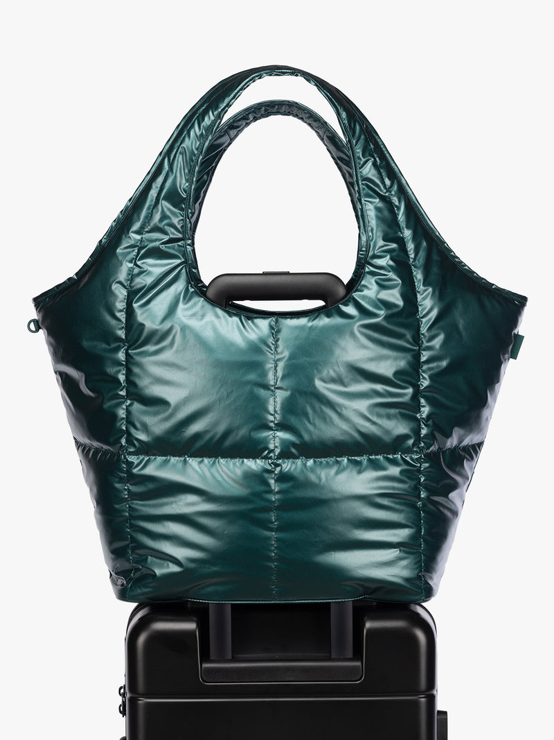 Luggage trolley sleeve of CALPAK Luka Everything Tote in dark green shiny Kale