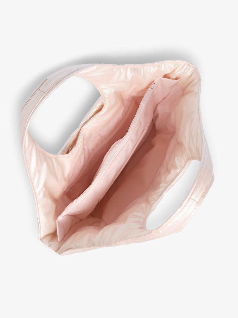 Opened CALPAK Luka Everything Tote in light pink Pearlescent