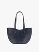 A navy blue crocodile-embossed CALPAK Haven Tulip tote bag with double shoulder straps against a plain white background; AHP2601-NAVY-FAUX-CROC