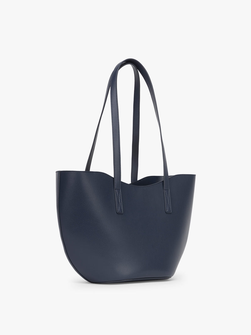 Side view of CALPAK Haven Tulip Tote in dark blue
