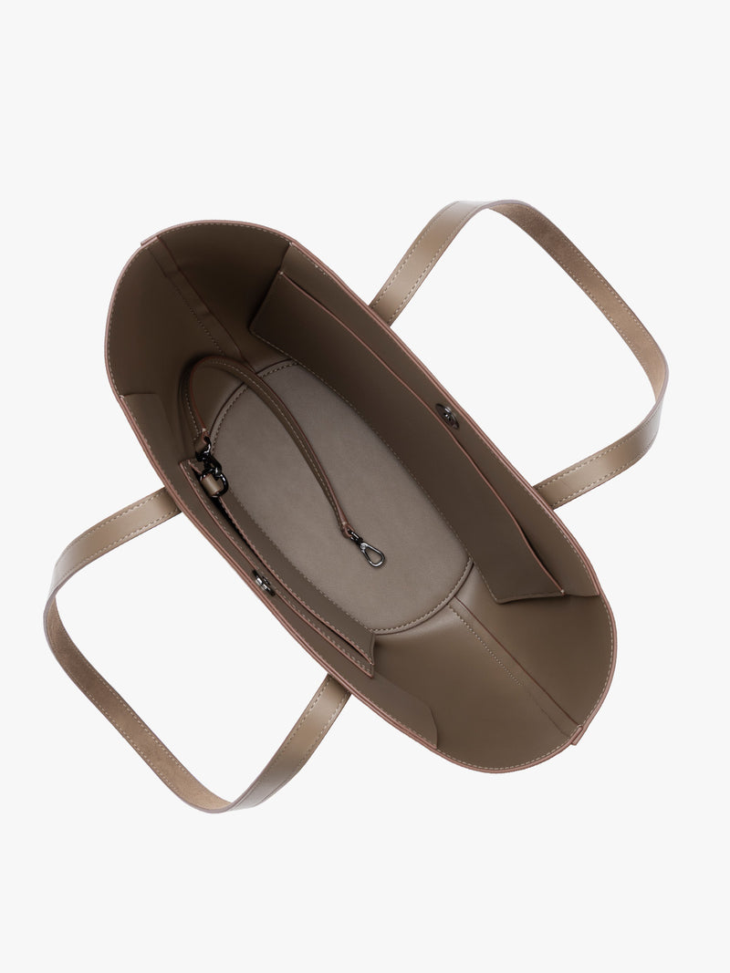 Opened view of CALPAK Haven Tulip Tote in Truffle Suede taupe brown tote bag with dual shoulder straps against a plain white background