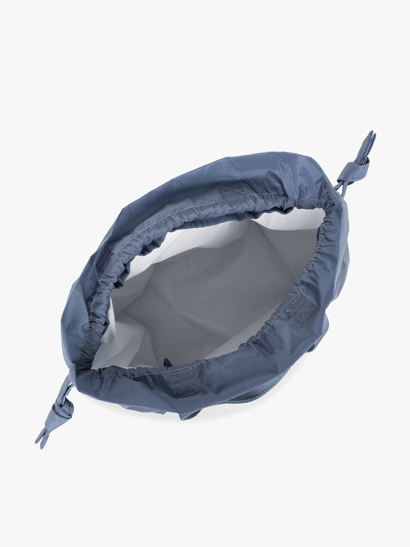 CALPAK Insulated Lunch Bag in Indigo view from the top with white interior