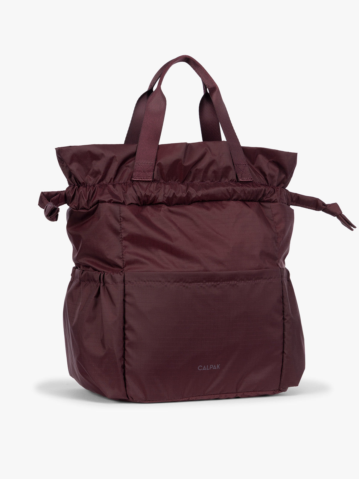 Dark Cherry burgundy CALPAK Insulated Lunch Bag with top handles, featuring an expandable function shown against a plain white background; ALB2001-DARK-CHERRY