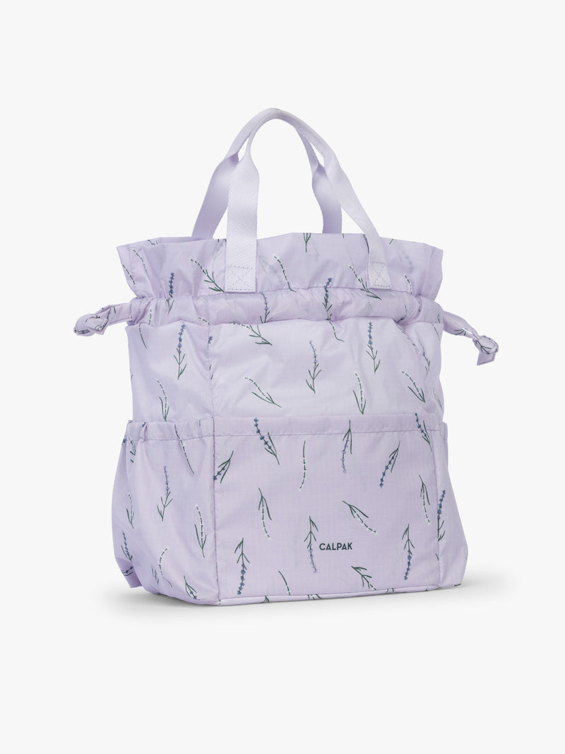 Opened drawstring of CALKPAK Insulated Lunch Bag in lavender purple with lavender flower print