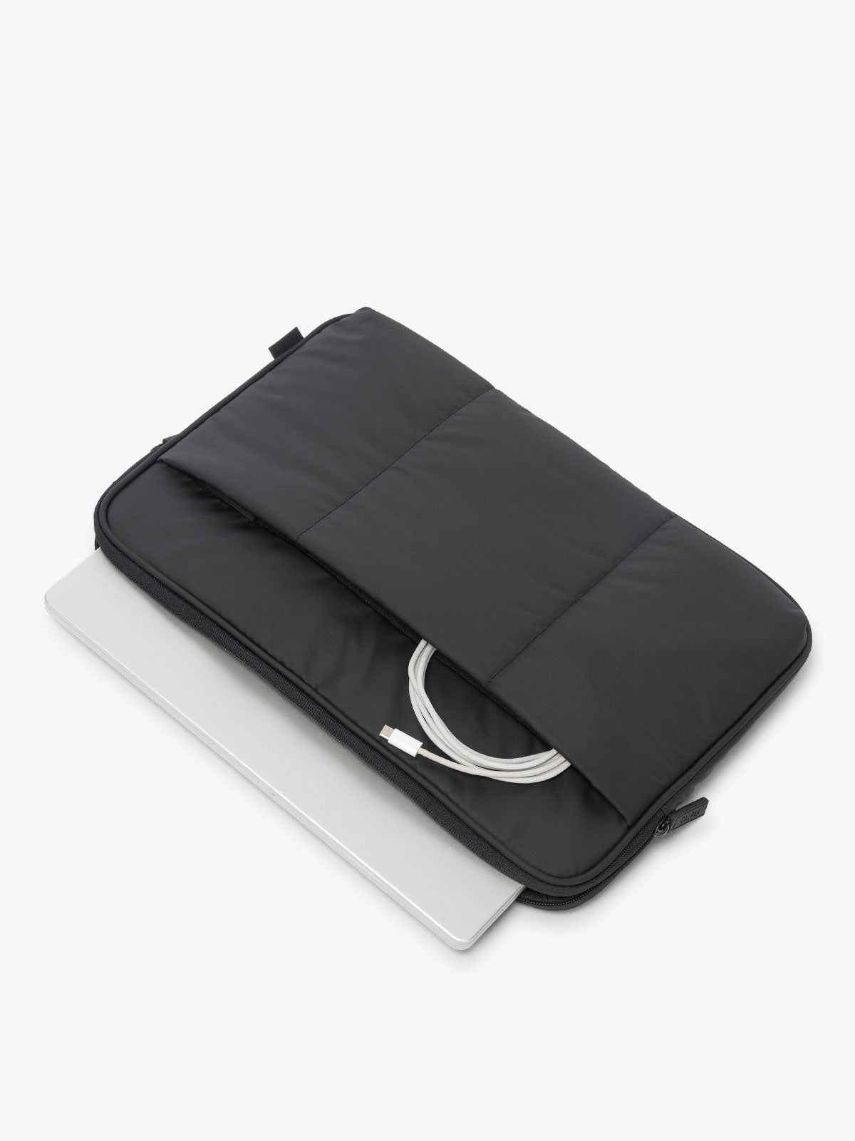 CALPAK Luka 17-in Padded Laptop Sleeve in black Matte Black with laptop and charger; ALD2501-MATTE-BLACK