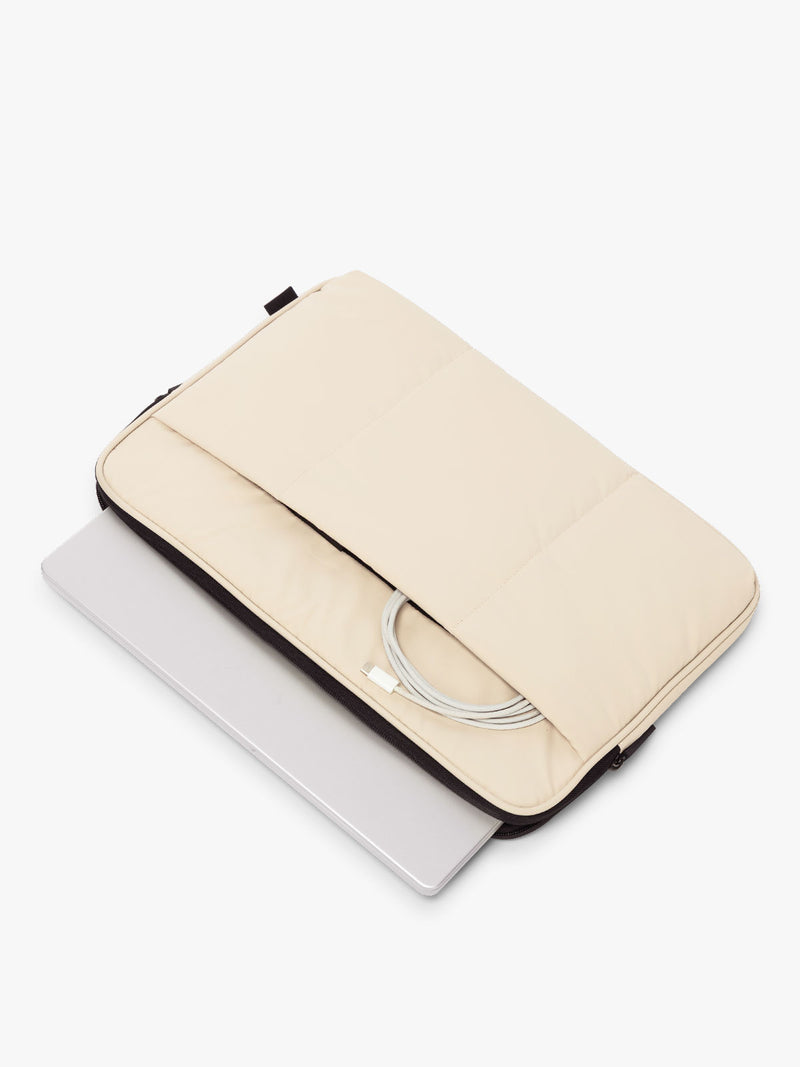 CALPAK Luka 17-in Padded Laptop Sleeve in creamy white Oatmeal with puffy exterior with laptop and charger