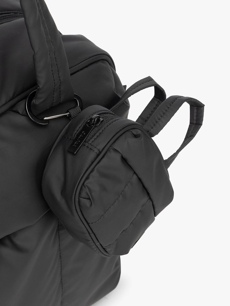 CALPAK Luka Duffel Key Pouch in black Matte Black clipped onto the Luka Duffel in black Matte Black