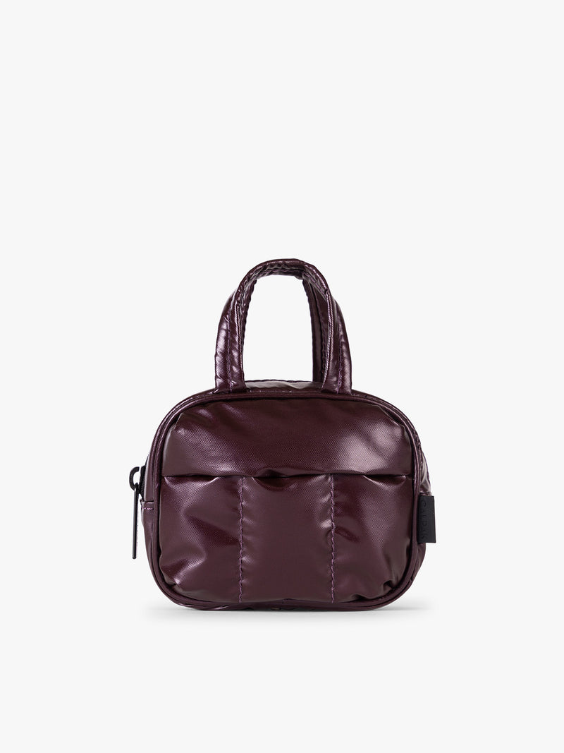 CALPAK Luka Duffel Key Pouch in maroon Glazed Dark Cherry on a white background