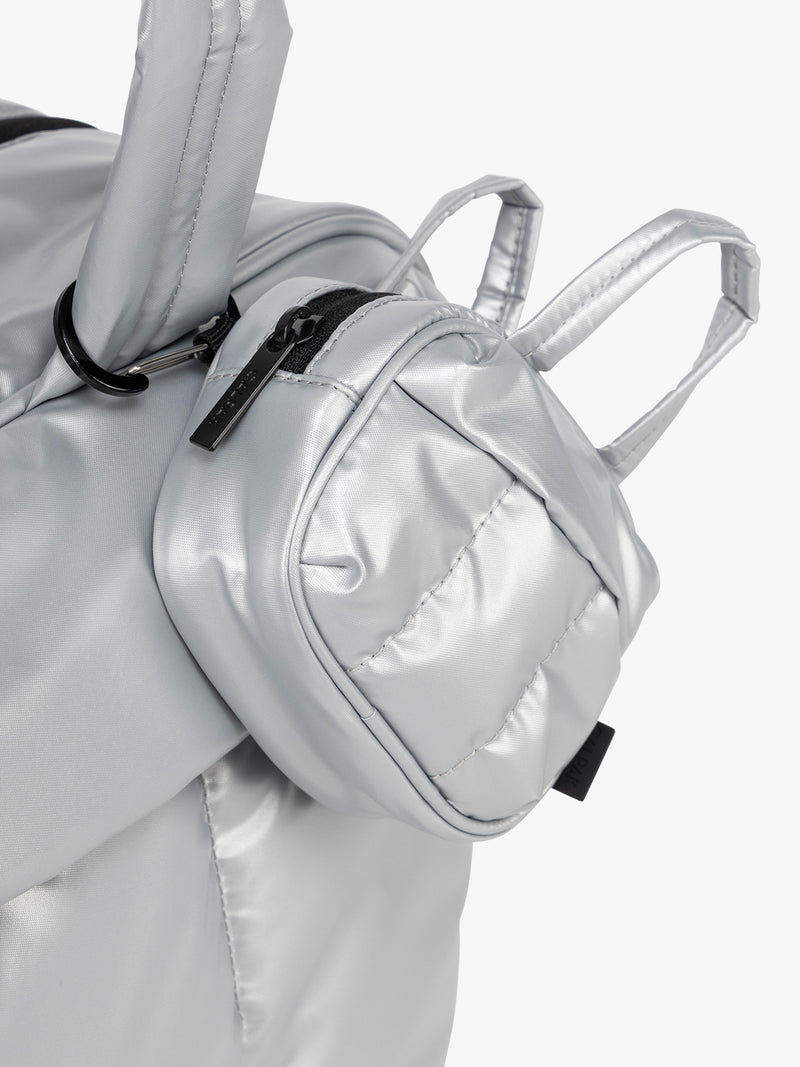 CALPAK Luka Duffel Key Pouch in Silver clipped on bag