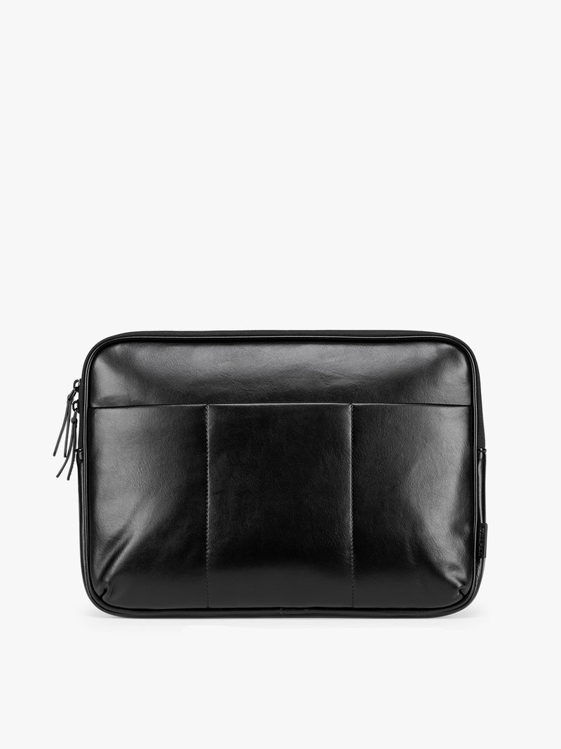Black vegan leather CALPAK Luka 14in Laptop Sleeve with a zippered top and a front pocket, shown against a plain white background