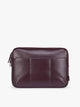 Deep burgundy Dark Cherry vegan leather CALPAK Luka 14in Laptop Sleeve with a zippered top and a front pocket, shown against a plain white background; ALL2401-DARK-CHERRY-PU