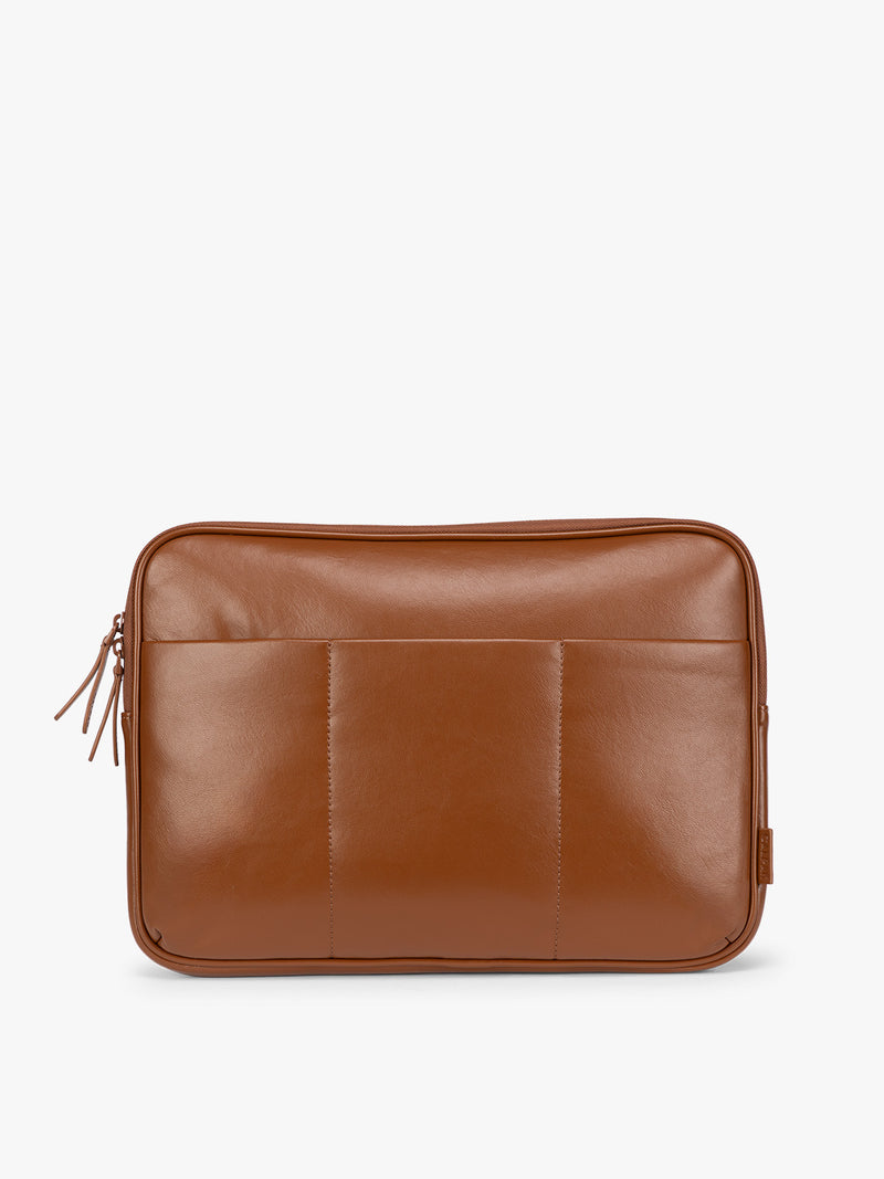 Light Honey Brown vegan leather CALPAK Luka 14in Laptop Sleeve with a zippered top and a front pocket, shown against a plain white background