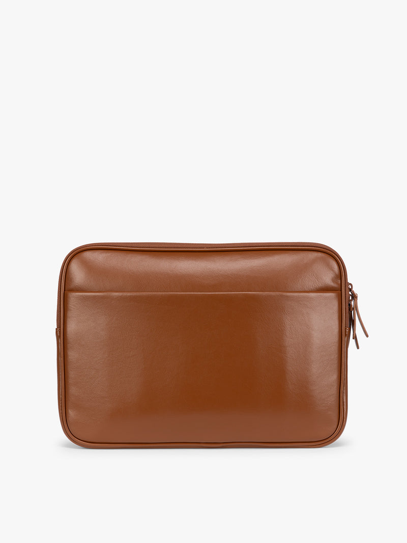 Backside of Light Honey Brown vegan leather CALPAK Luka 14in Laptop Sleeve with a zippered top and a front pocket, shown against a plain white background