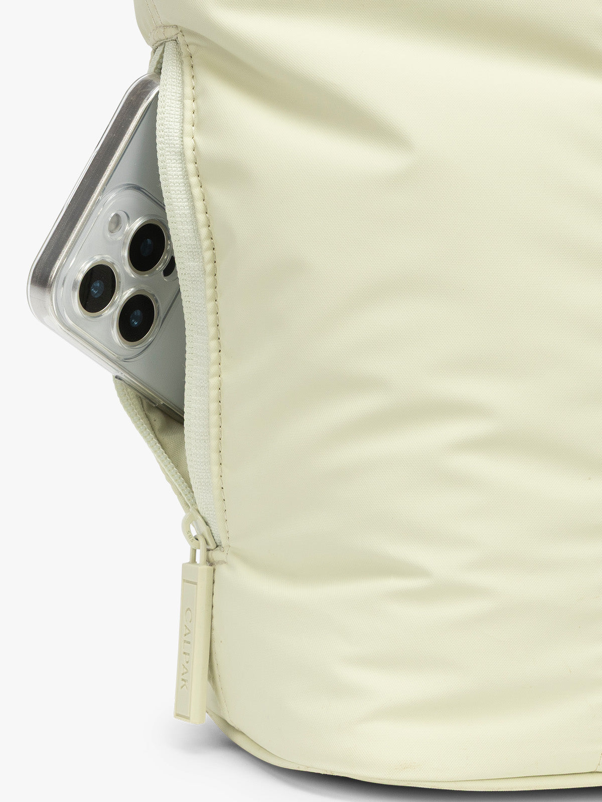 Side phone pocket of CALPAK Luka Mini Tote in light green Celadon; ALM2401-CELADON