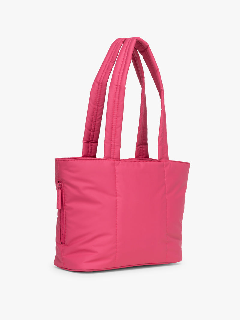 Side view of CALPAK Luka Mini Tote in bright pink Dragonfruit on a white background