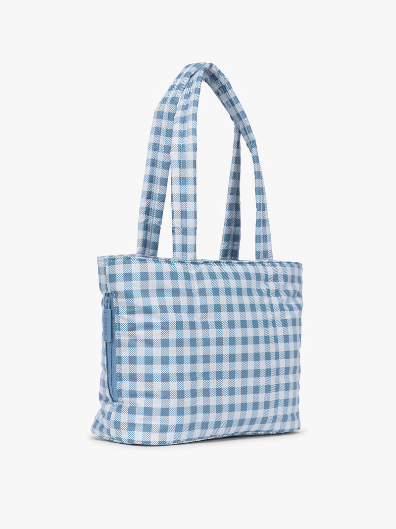 Side view of CALPAK Luka Mini Tote in white and blue gingham pattern in French Blue Gingham