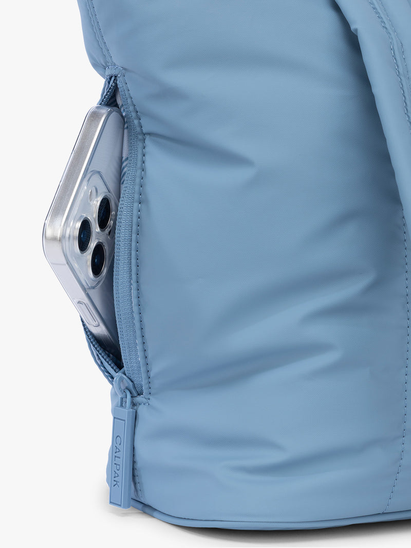 Side phone pocket with zipper of CALPAK Luka Mini Tote in light blue French Blue