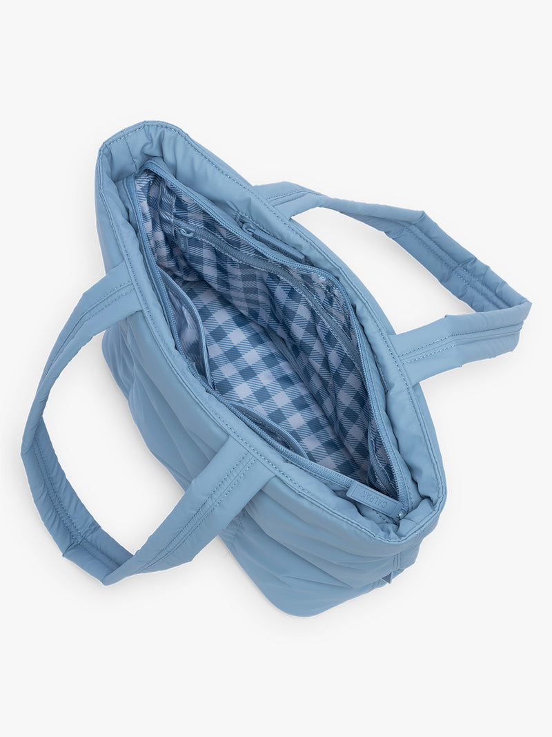 Opened CALPAK Luka Mini Tote in light blue French Blue with light blue and white gingham interior