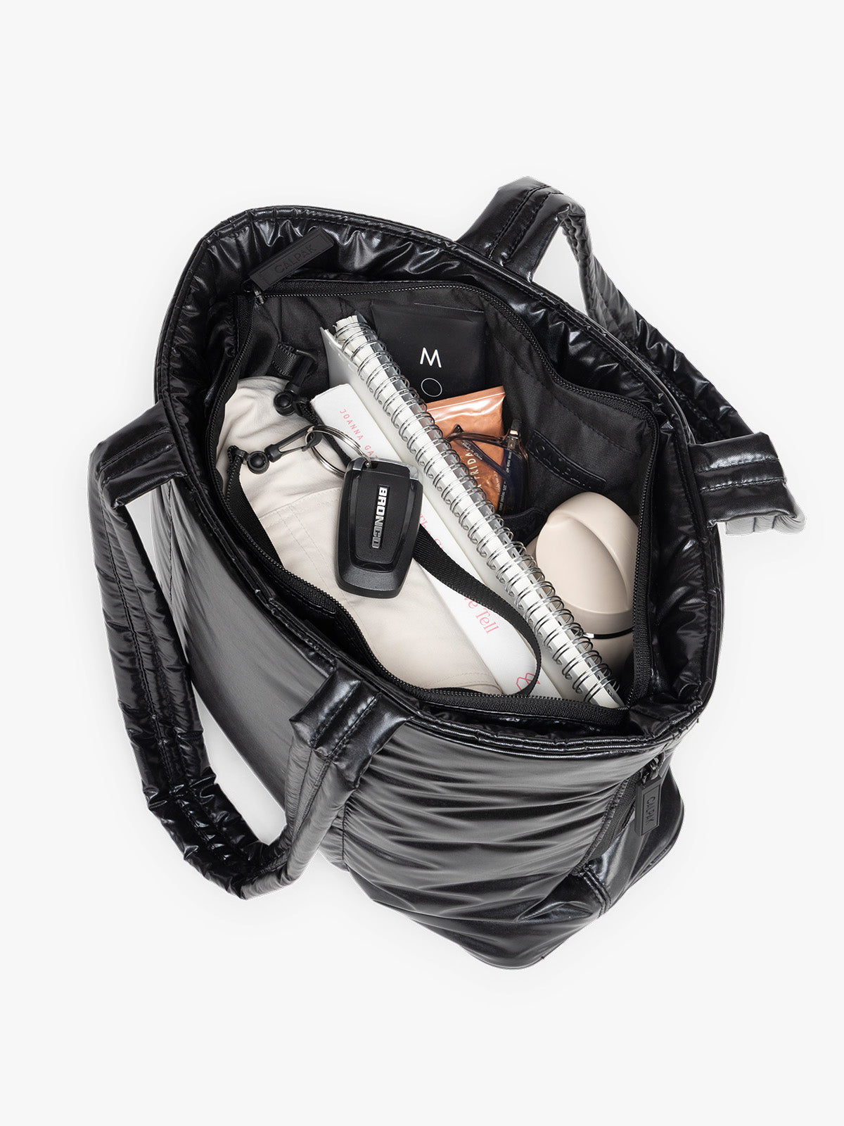 Opened view of CALPAK Luka Mini Tote in shiny Glazed Black on a white background; ALM2401-GLAZED-BLACK