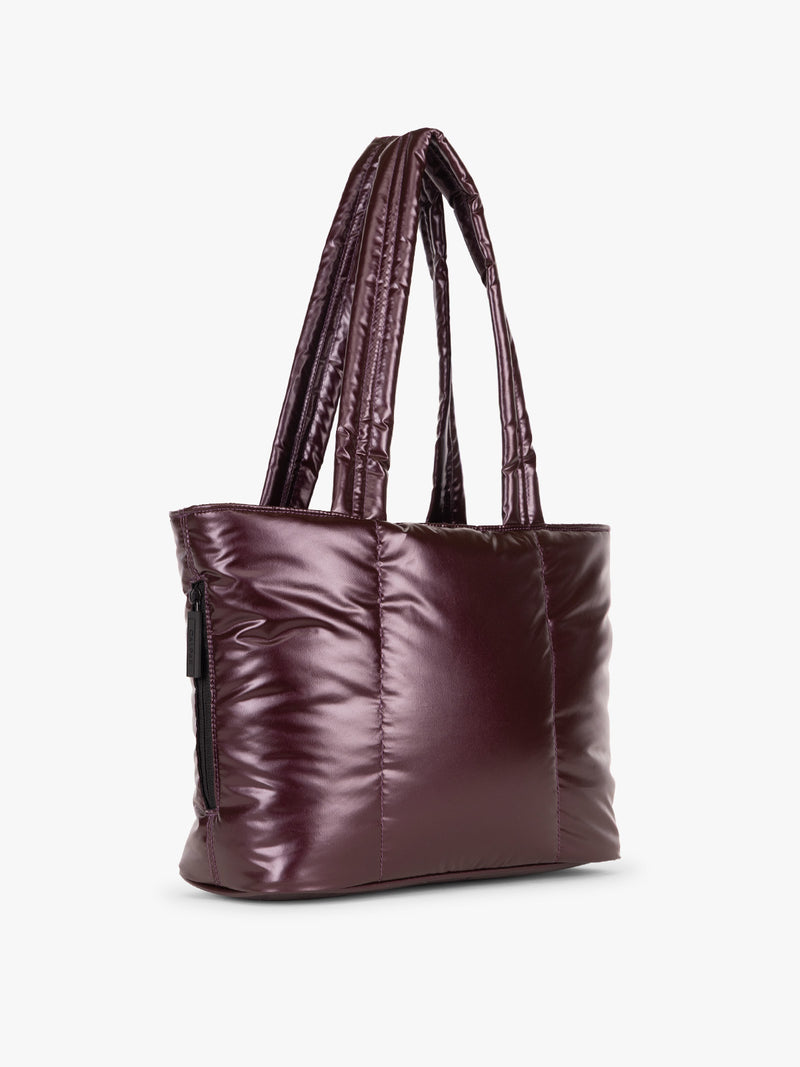 Side view of CALPAK Luka Mini Tote in shiny maroon Glazed Dark Cherry on a white background