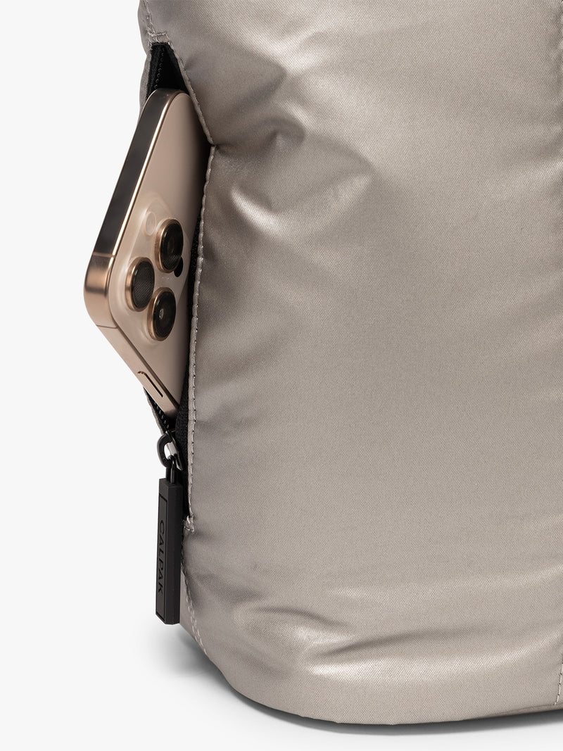 Side zip phone pocket of CALPAK Luka Mini Tote in metallic Gumetal grey a white background