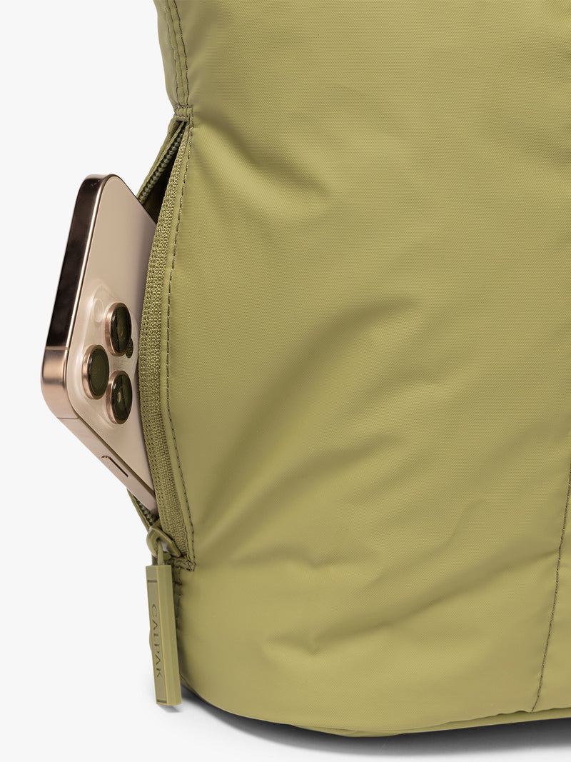 Side zip phone pocket of CALPAK Luka Mini Tote in green Pistachio on a white background