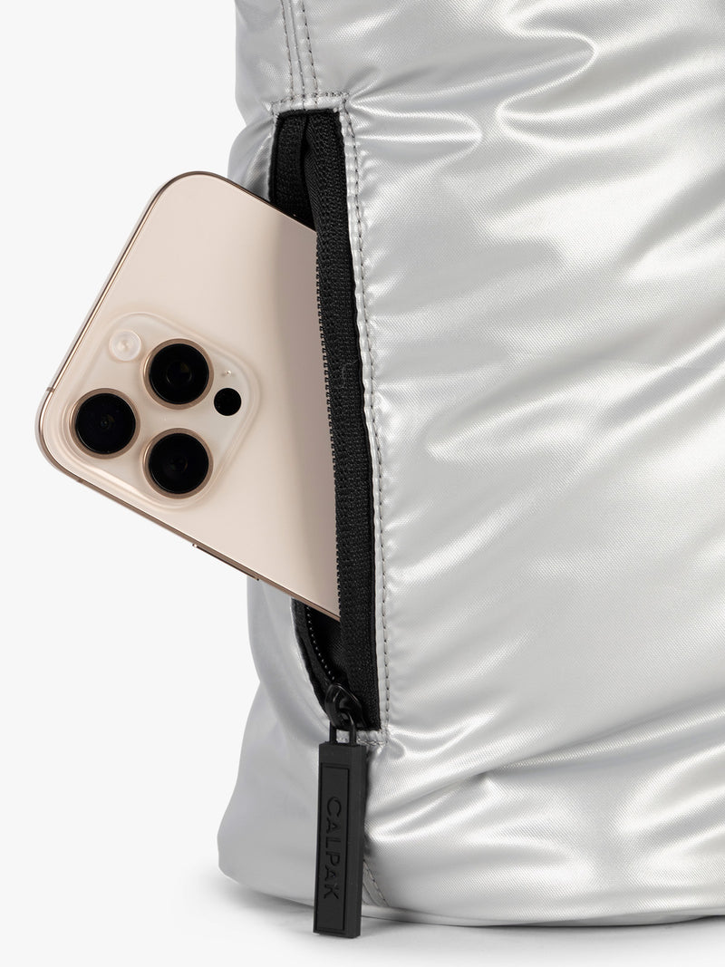 Side phone pocket view of CALPAK Luka Mini Tote in shiny Silver on a white background