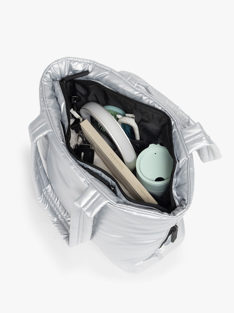 Opened view of CALPAK Luka Mini Tote in shiny Silver on a white background