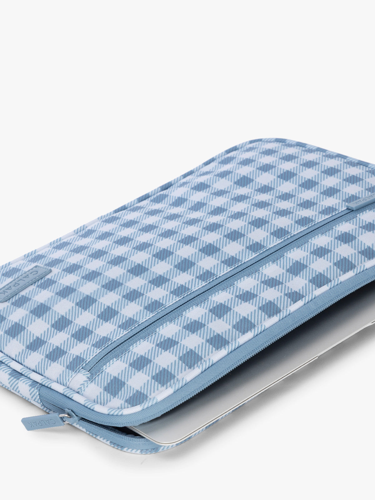 Flatlay with laptop in the CALPAK Padded Laptop Sleeve 13" in white and blue gingham print in French Blue Gingham; ALP2213-FRENCH-BLUE-GINGHAM